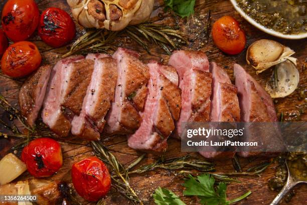 crispy pan seared  duck breast with basil and cilantro pesto - sears canada stock pictures, royalty-free photos & images