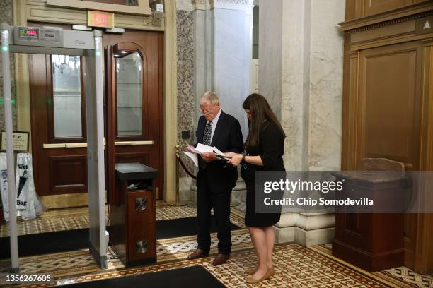 Senate Armed Services Committee ranking member Sen. James Inhofe reads and makes last minute changes to a speech he will give on the floor of the...