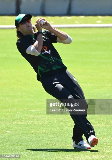 Lachlan Bangs of the Stars takes a catchto dismiss Unmukt Chand of the Renegades during a BBL practice match between the Melbourne Renegades and the...