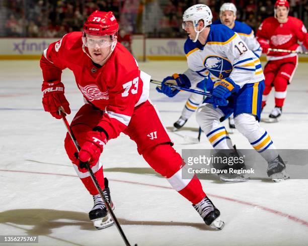 Adam Erne of the Detroit Red Wings follows the play against the Buffalo Sabres during an NHL game at Little Caesars Arena on November 27, 2021 in...