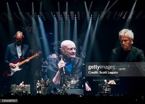 Mike Rutherford, Phil Collins, Nic Collins and Tony Banks of Genesis perform during their "The Last Domino?" Tour at Little Caesars Arena on November...