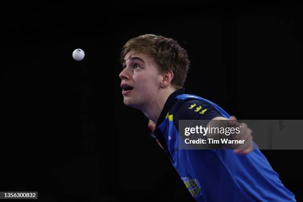 Truls Moregard of Sweden serves to Fan Zhendong of China during the men's singles finals match of the 2021 ITTF World Table Tennis Championships at...