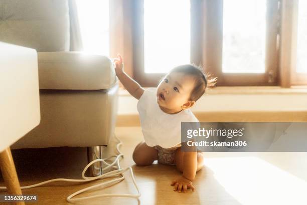 morning mood asian baby wake up early and crawling and  playing toys on the ground - 這う ストックフォトと画像