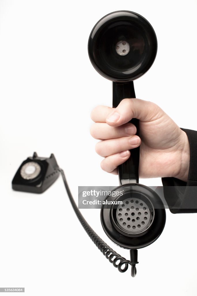 Weibliche hand holding klassische vintage Schwarze Telefonhörer