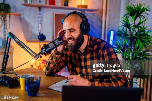 man recording a podcast - television host stock pictures, royalty-free photos & images