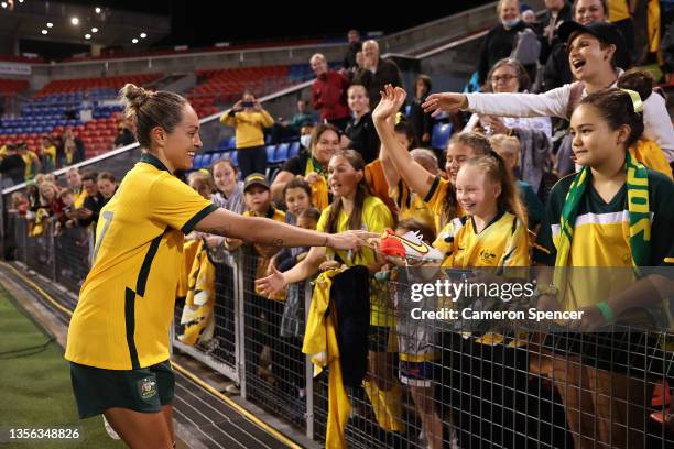 Kyah Simon of the Matildas hands her boots to fans following game two of the International Friendly series between the Australia Matildas and the...