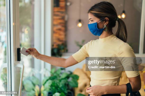 safety in the office during covid-19 pandemic - businesswoman mask stock pictures, royalty-free photos & images