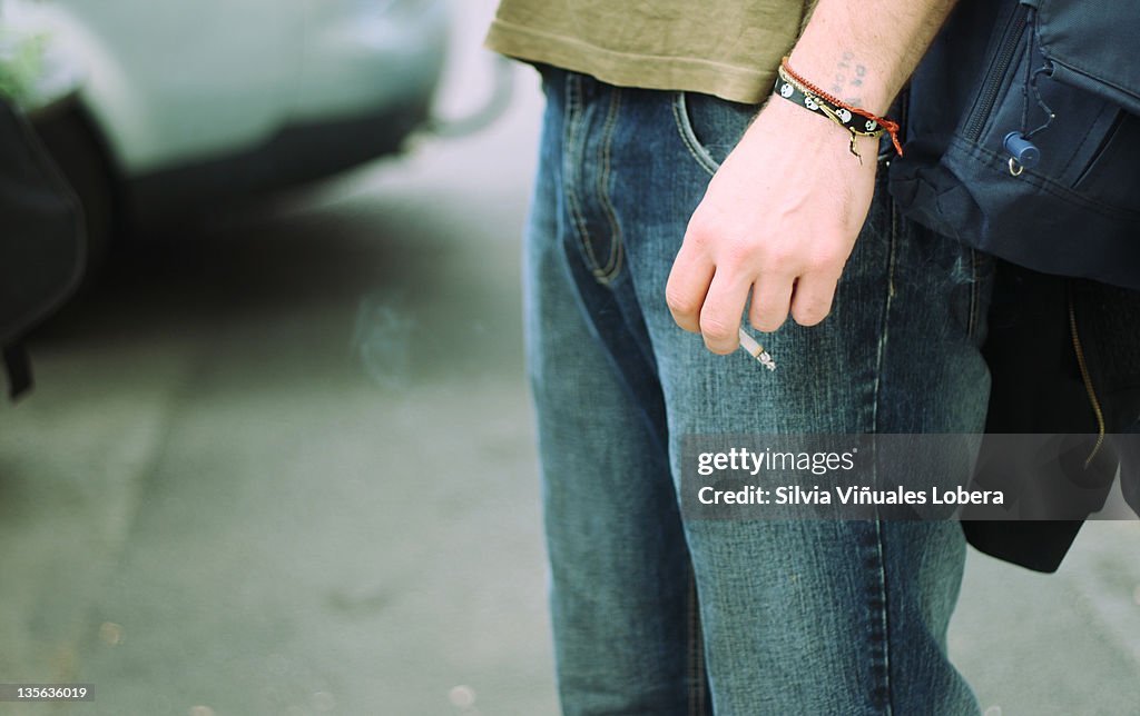 Man holding cigarette