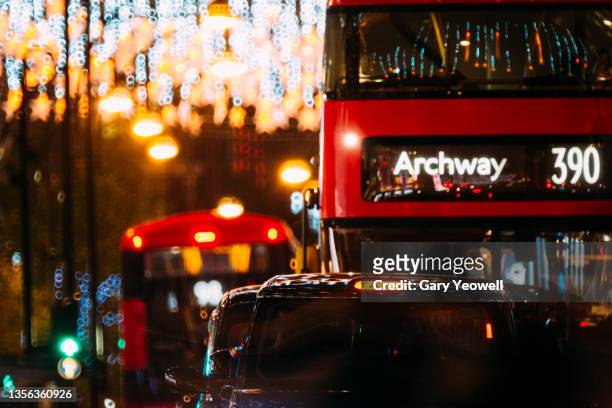 christmas in london - london bus stock pictures, royalty-free photos & images