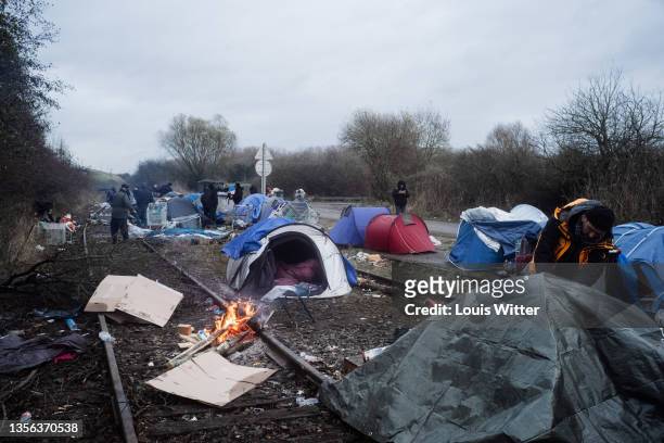The police approach this camp with cleaning teams, to take and destroy the tents of the migrants, during an eviction on November 30, 2021 in...