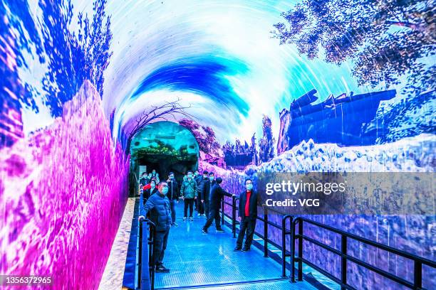 Tourists visit the Time Tunnel of Qiandao Lake, a visual project using naked-eye 3D and 360-degree immersive interactive virtual reality technology,...