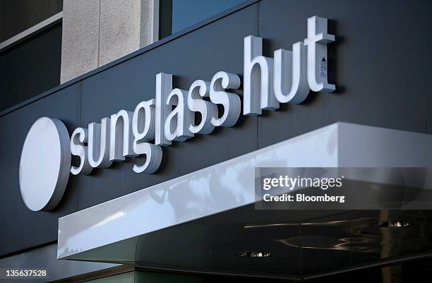 Sunglass Hut International Inc. Signage is displayed outside of a store at the Third Street Promenade outdoor mall in Santa Monica, California.,...