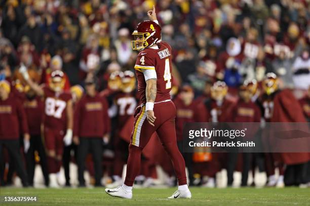 Taylor Heinicke of the Washington Football Team celebrates after a touchdown against the Seattle Seahawks during the third quarter at FedExField on...