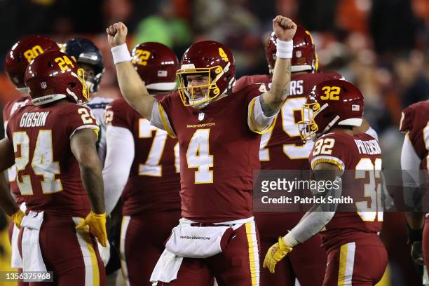 Taylor Heinicke of the Washington Football Team celebrates after defeating the Seattle Seahawks at FedExField on November 29, 2021 in Landover,...