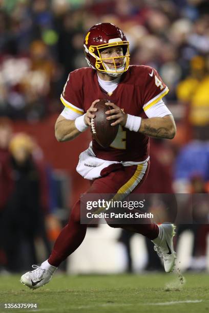 Taylor Heinicke of the Washington Football Team looks to pass against the Seattle Seahawks at FedExField on November 29, 2021 in Landover, Maryland.