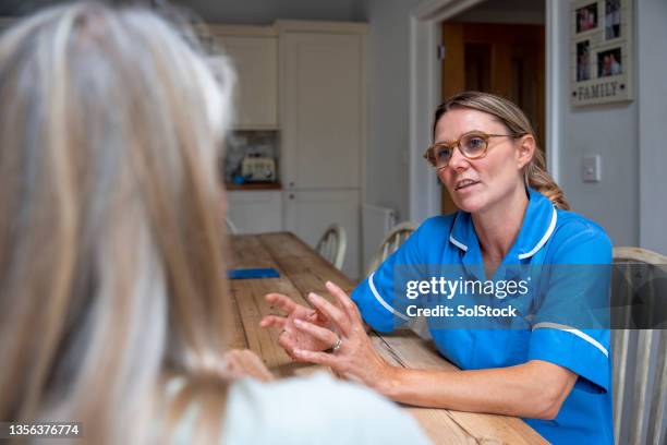 understanding patient's needs - home visit stock pictures, royalty-free photos & images