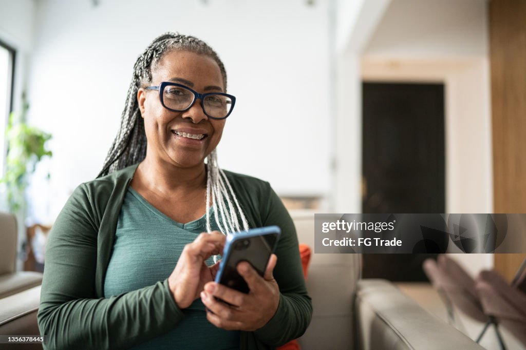 Portrait of a senior woman using a mobile phone at home