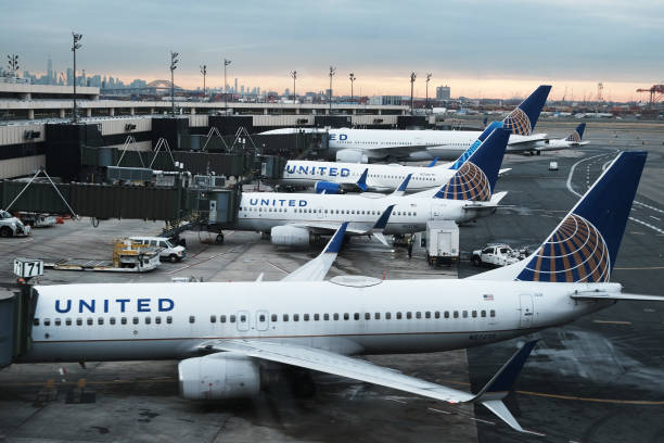 United Airlines planes sit on the runway at Newark Liberty International Airport on November 30, 2021 in Newark, New Jersey. The United States, and a...