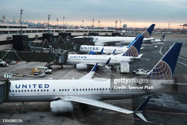 United Airlines planes sit on the runway at Newark Liberty International Airport on November 30, 2021 in Newark, New Jersey. The United States, and a...