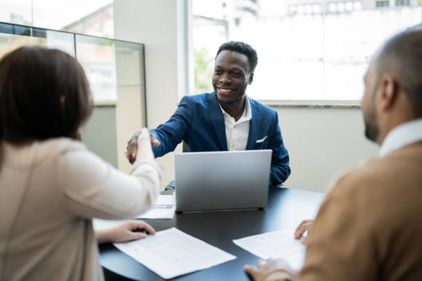 How to Start a Financial Service Company in South Africa 1 customer shaking hands with car salesman buying a car