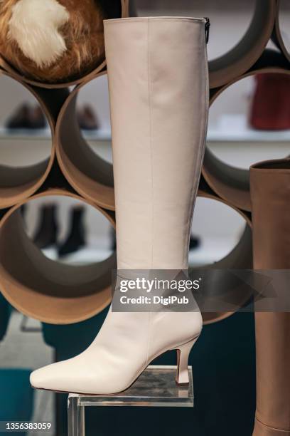 women's boots - beige boot stock pictures, royalty-free photos & images