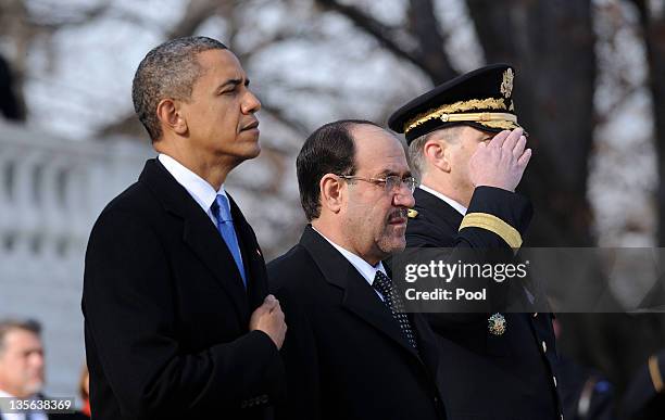 President Barack Obama and Iraqi Prime Minister Nouri al-Maliki participate in a wreath laying ceremony at Arlington National Cemetery December 12,...