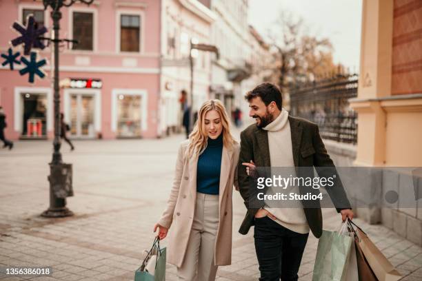 casual chat after an afternoon date - city shopping stock pictures, royalty-free photos & images