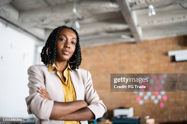 portrait of a young woman at work - portrait of cool creative businesswoman at office bildbanksfoton och bilder