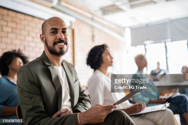 portrait of a man in a business conference - participant stock pictures, royalty-free photos & images