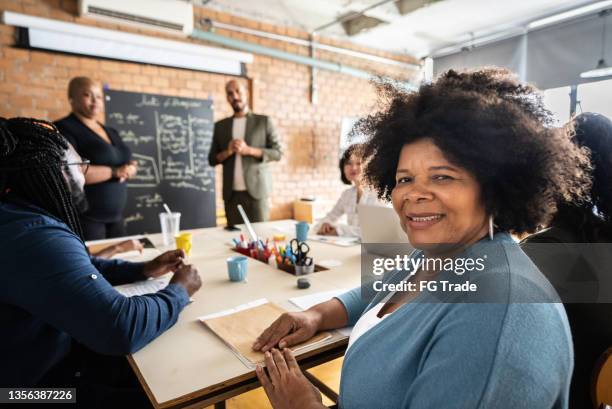 portrait of a businesswoman during a business meeting - brazil training and press conference stock pictures, royalty-free photos & images