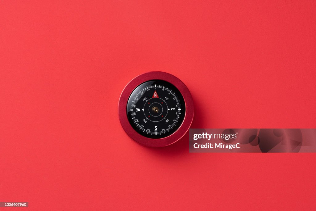 Navigational Compass on Red Background