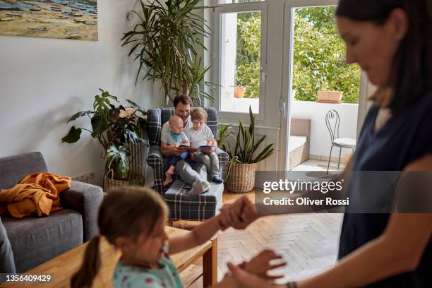 family of five in living room at home - family at home stock pictures, royalty-free photos & images