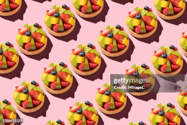 assorted fruit tart repetition pattern - double portion stock pictures, royalty-free photos & images
