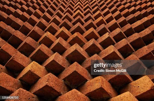 orange brick pointy feature wall - brick building exterior stock pictures, royalty-free photos & images