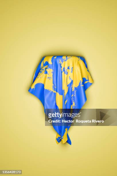 planet earth with fabric shape on yellow background, concept global climate change and polar melting - earth destruction stock pictures, royalty-free photos & images