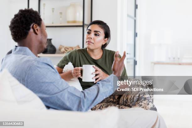 husband and wife having serious conversation - couple talking stock pictures, royalty-free photos & images