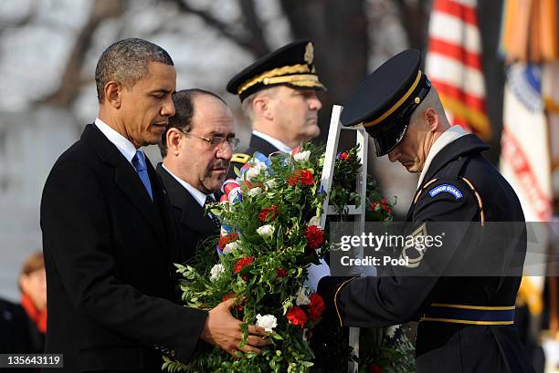 President Barack Obama and Iraqi Prime Minister Nouri al-Maliki participate in a wreath laying ceremony at Arlington National Cemetery December 12,...