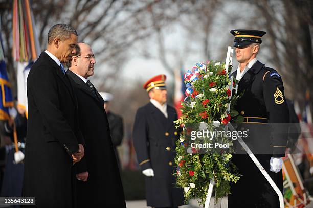 President Barack Obama and Iraqi Prime Minister Nouri al-Maliki participate in a wreath laying ceremony at Arlington National Cemetery December 12,...