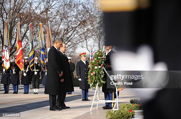 President Barack Obama and Iraqi Prime Minister Nouri al-Maliki participate in a wreath laying ceremony at Arlington National Cemetery December 12,...