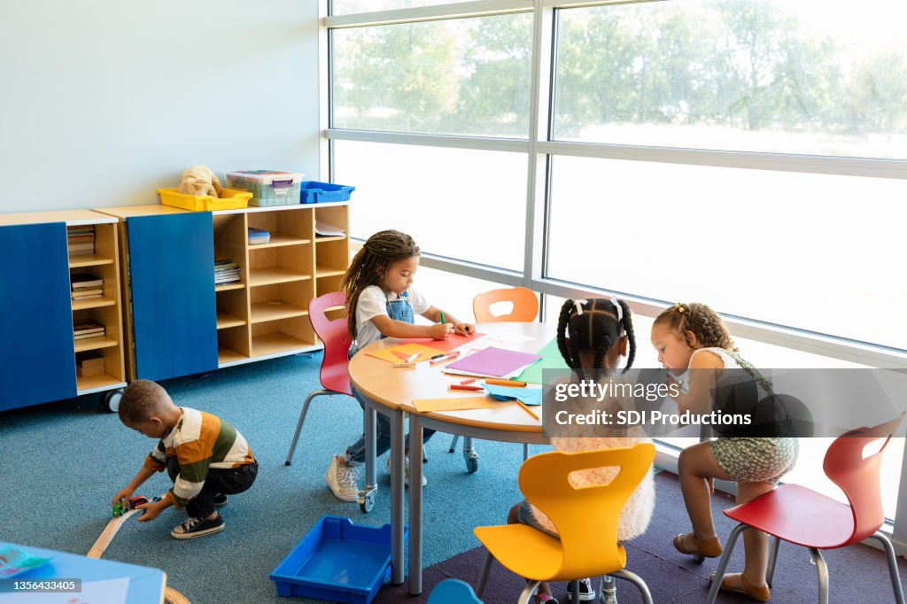 Busy preschool children enjoy their time in daycare