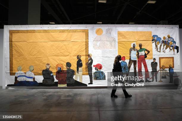 Guests view an Untitled work from Brazilian artist Maxwell Alexandre New Power Series presented by A Gentil Carioca Gallery at Miami Beach Convention...