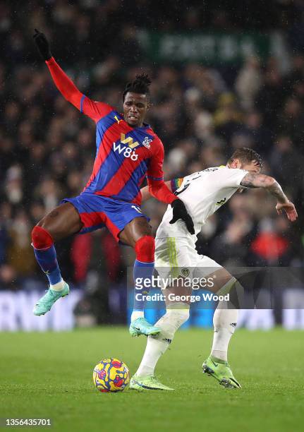 Wilfried Zaha of Crystal Palace battles for possession with Liam Cooper of Leeds United during the Premier League match between Leeds United and...