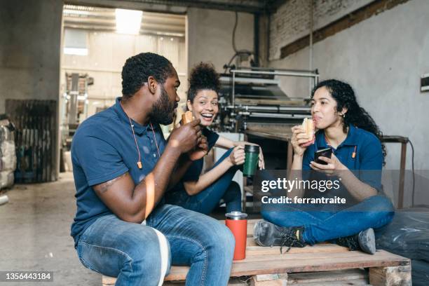 factory coworkers at lunch break - lunch break stock pictures, royalty-free photos & images