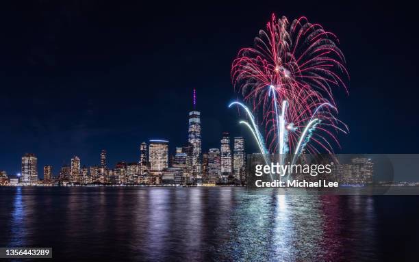 diwali fireworks on hudson river with world trade center in background - diwali festival of lights stock pictures, royalty-free photos & images