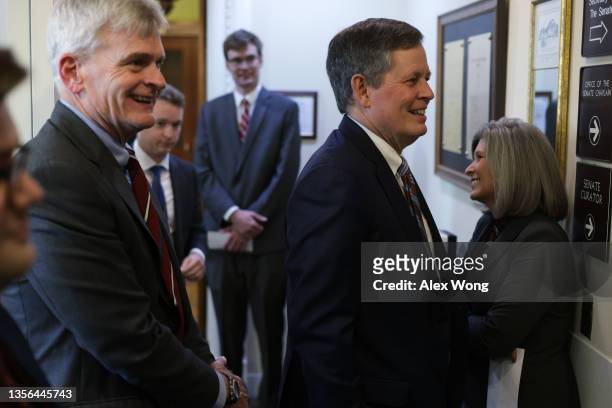 Sen. Bill Cassidy , Sen. Steven Daines and Sen. Joni Ernst wait for the beginning of a news conference on abortion at the U.S. Capitol November 30,...