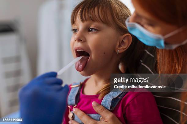 open wide so we can see your throat - tongue depressor stock pictures, royalty-free photos & images