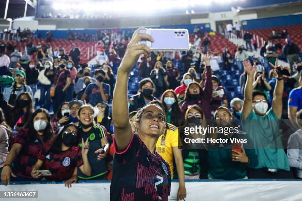 Kenti Robles of Mexico takes a selfie with fans during the Women's International Friendly between Mexico and Canada at Estadio Ciudad de los Deportes...