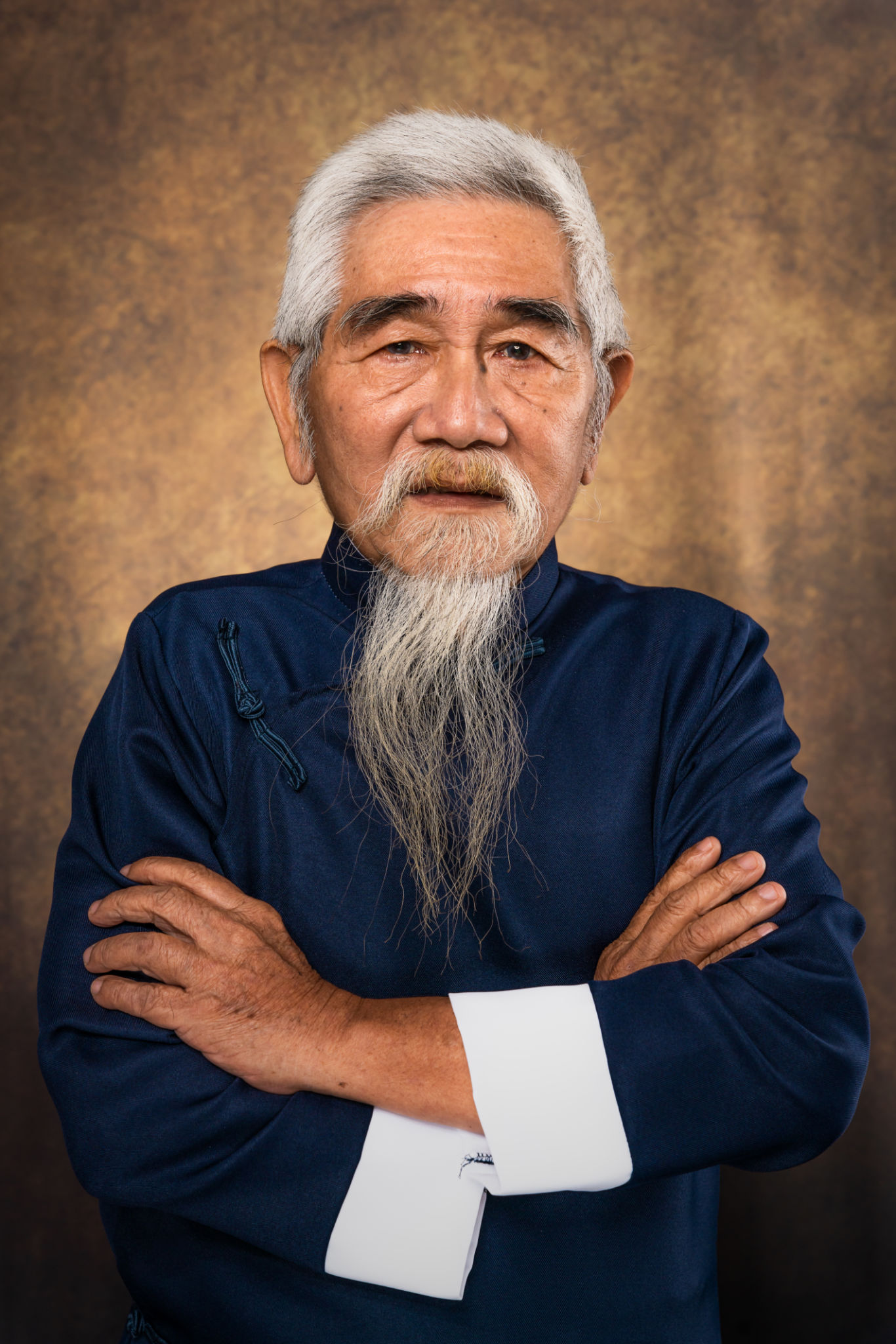 studio portrait of chinese old man with white hair and beard in traditional chinese clothing on studio backdrop background studio portrait of chinese old man with white hair and beard in traditional chinese clothing on studio backdrop background