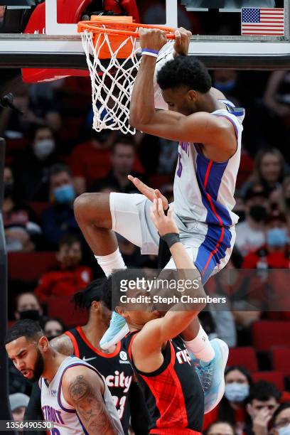 Hamidou Diallo of the Detroit Pistons attempts to dunk against Anfernee Simons of the Portland Trail Blazers during the second quarter at Moda Center...