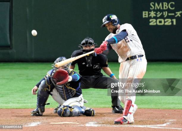 Domingo Santana of the Yakult Swallows hits a two run home run in the 7th inning during the Japan Series Game Three against Orix Buffaloes at Tokyo...